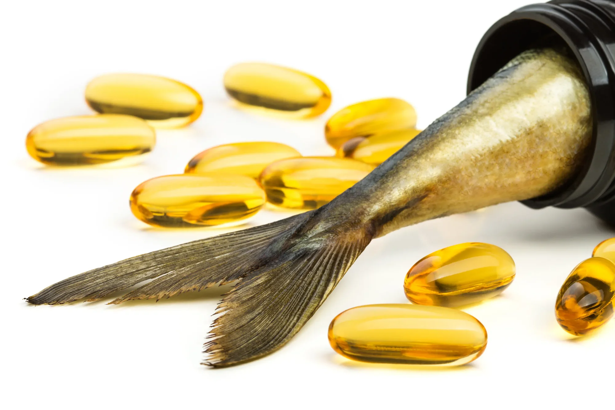 Fish oil capsules scattered about and a fish tail coming out of brown supplement jar.