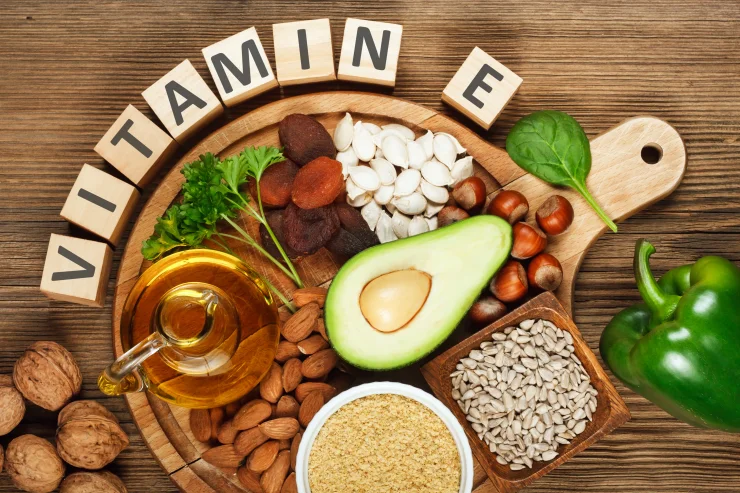 Foods rich in vitamin E such as wheat germ oil, dried wheat germ, dried apricots, hazelnuts, almonds, parsley leaves, avocado, walnuts, pumpkin seeds, sunflower seeds, spinach and green paprika