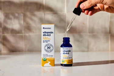 A bottle of NativePath Vitamin D3+K2 tincture with the dropper