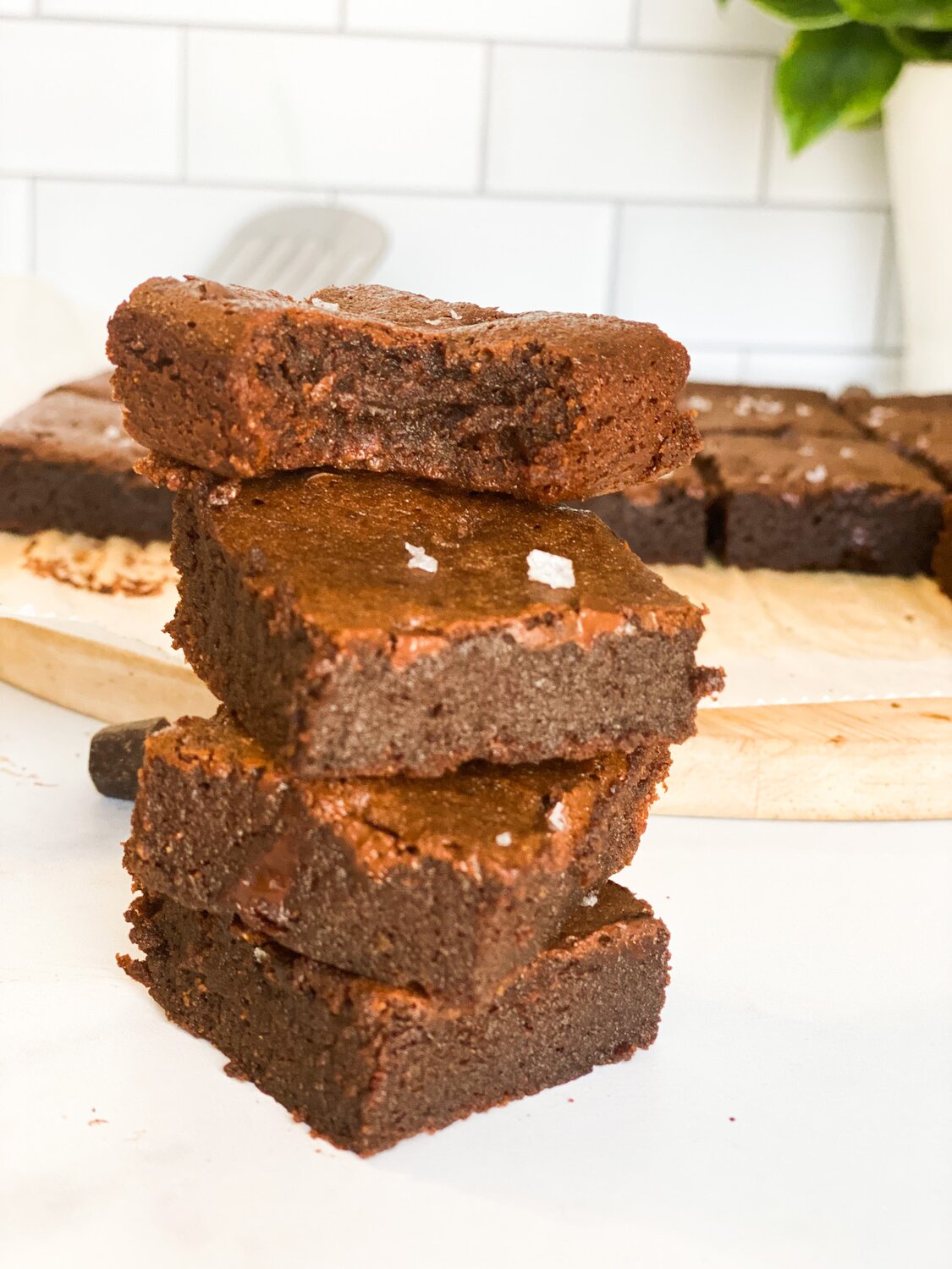 A close-up shot three brownies stacked on top of each other.
