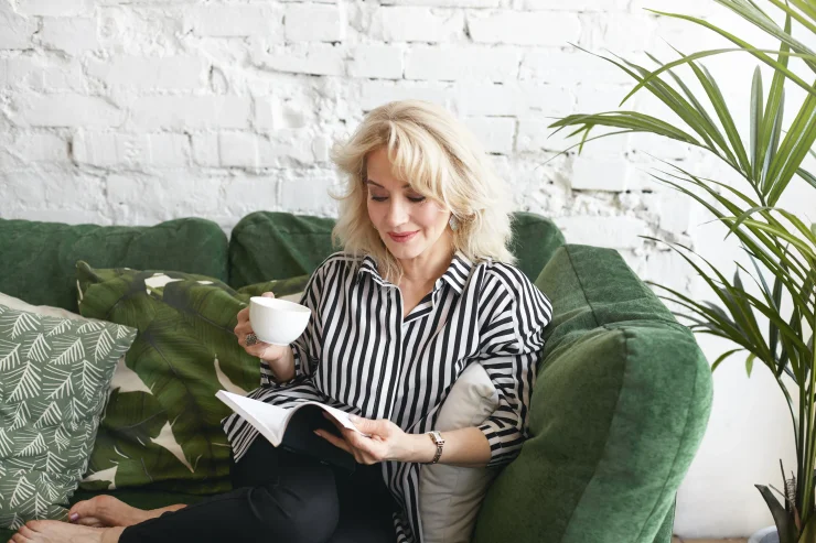 Beautiful Older Woman Reading and Practicing Self Care