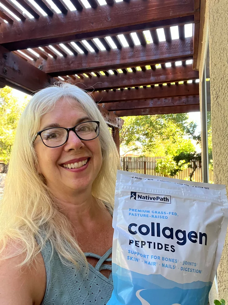 An older woman holding a 56-serving bag of NativePath Original Collagen Peptides