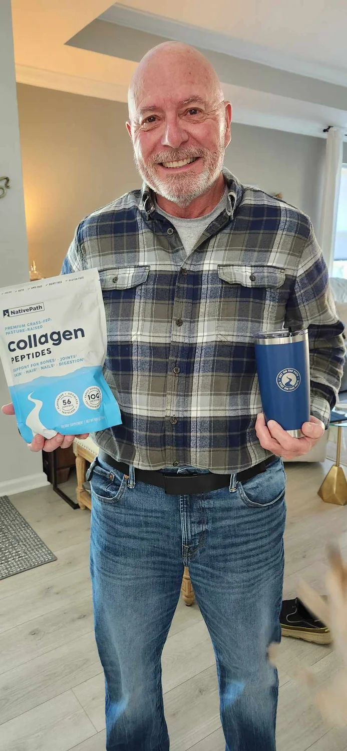 An older man posing with a 56-serving bag of NativePath Original Collagen Peptides and a dark blue NativePath tumbler