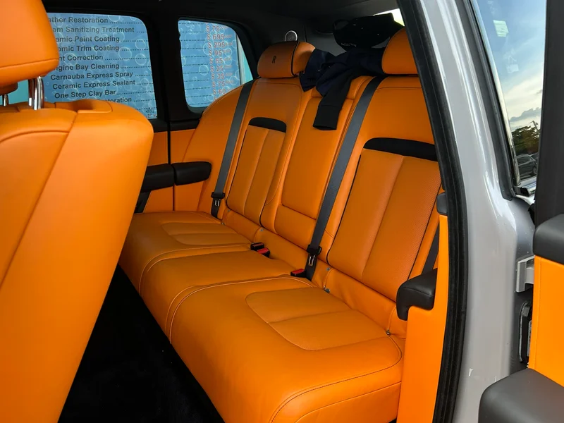 Orange leather rear seats of a luxury SUV