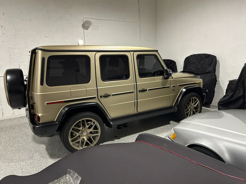 Matte gold SUV parked in a detailing garage