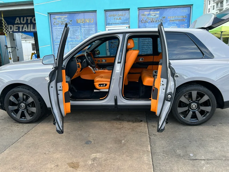 Silver luxury SUV with doors open