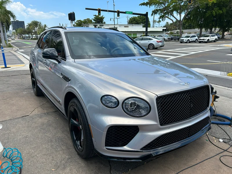 Silver luxury SUV parked at the detailing station