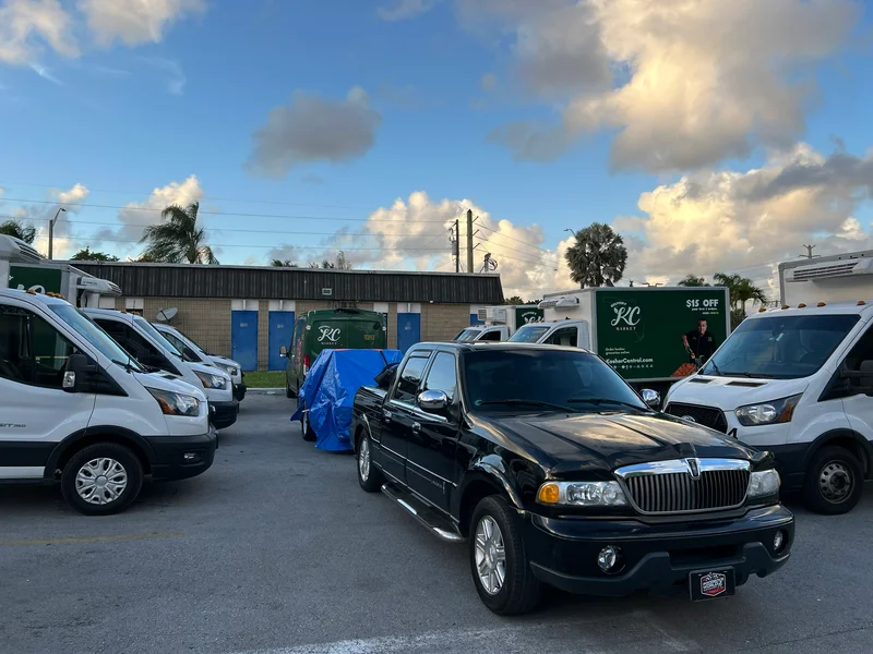 Vans and pickups parked at the fleet service lot