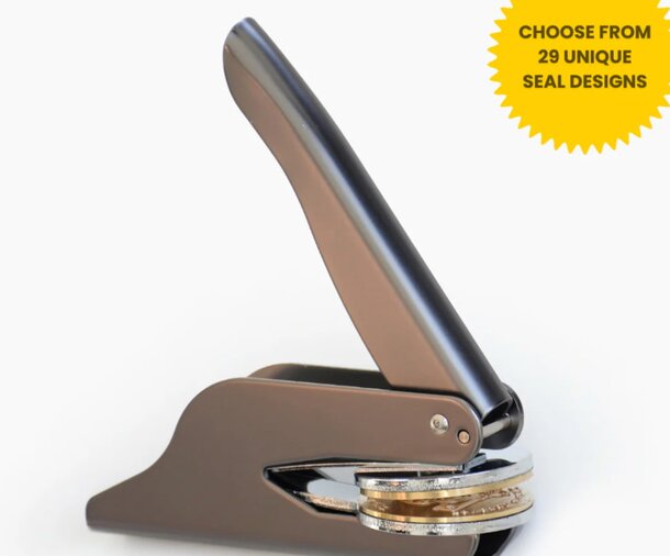 Three women joyfully walk in a mall, holding colorful shopping bags. They wear casual outfits and smile, conveying a cheerful, relaxed atmosphere.