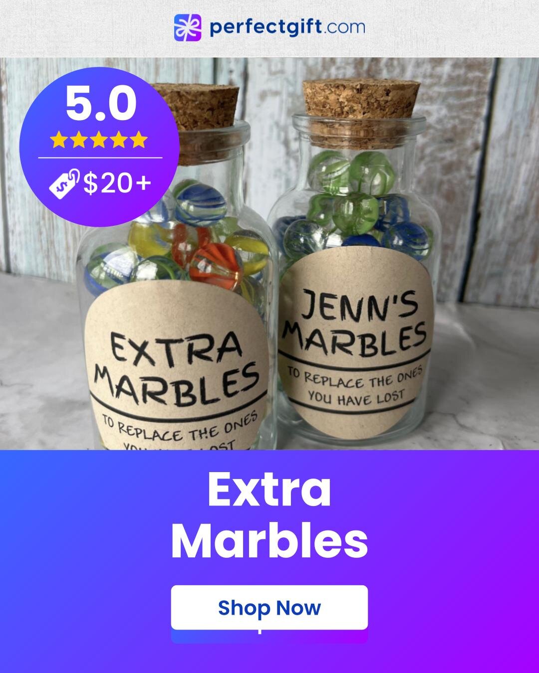 A colorful assortment of extra marbles presented as a gift, showcasing various sizes and patterns in a decorative box.
