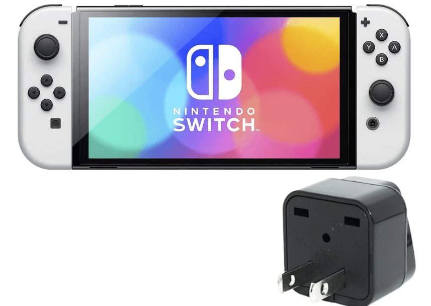 A Nintendo Switch OLED model with Joy-Cons in white. The screen displays the Nintendo Switch logo over a colorful bokeh background. Below is a black power adapter.