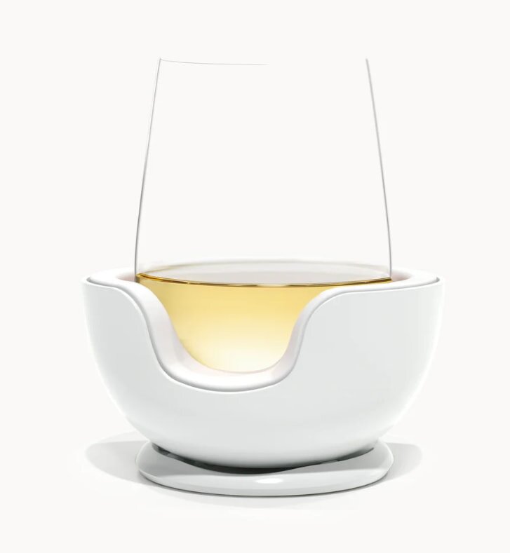 A wine glass featuring a clear bowl and stem, elegantly showcasing its contents.
