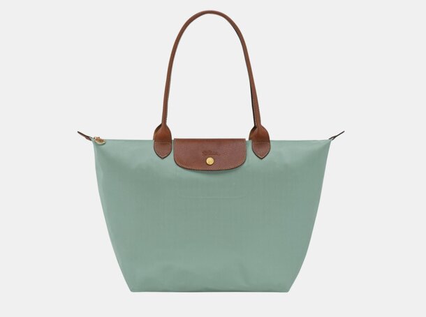 Longchamp tote bag in mint green, featuring a sleek design and sturdy handles, perfect for everyday use.
