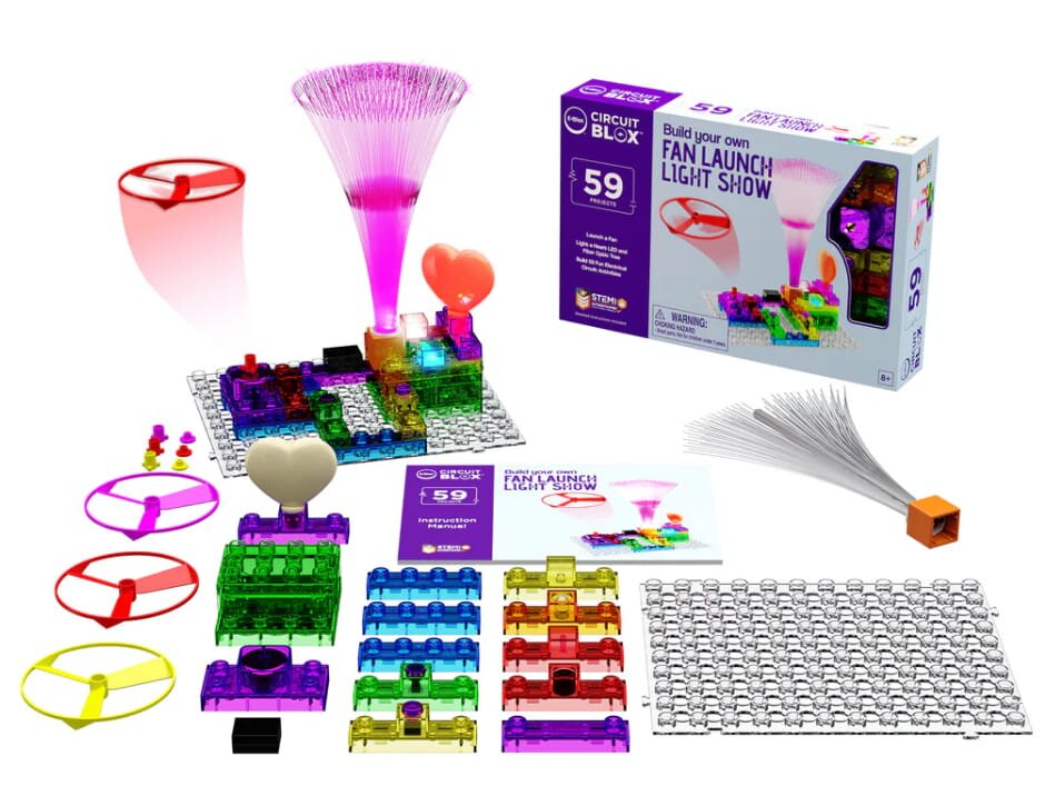 A LEGO Mindstorms kit displayed alongside a glowing toy, showcasing its interactive and creative features.