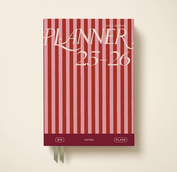 A planner featuring a design of red and white stripes on its cover.