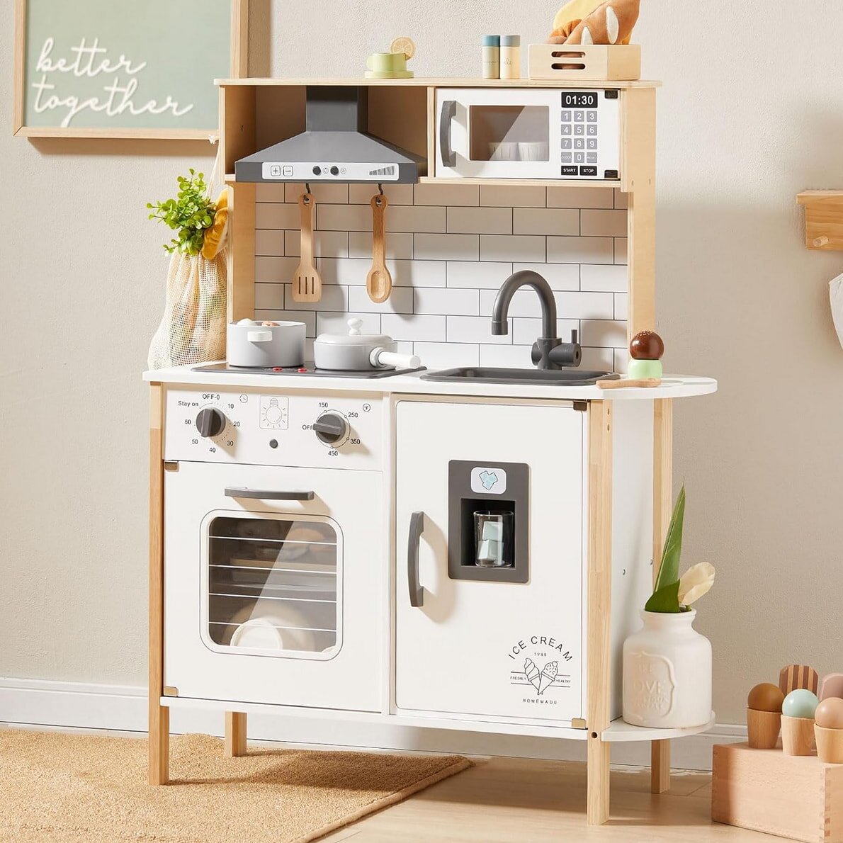 A colorful toy kitchen featuring a microwave and an oven, designed for imaginative play.