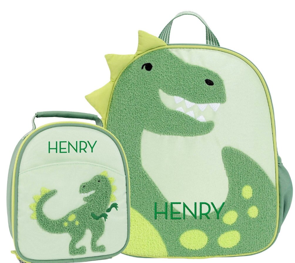 A dinosaur-themed backpack and lunch bag set featuring the name "Henry" prominently displayed on both items.