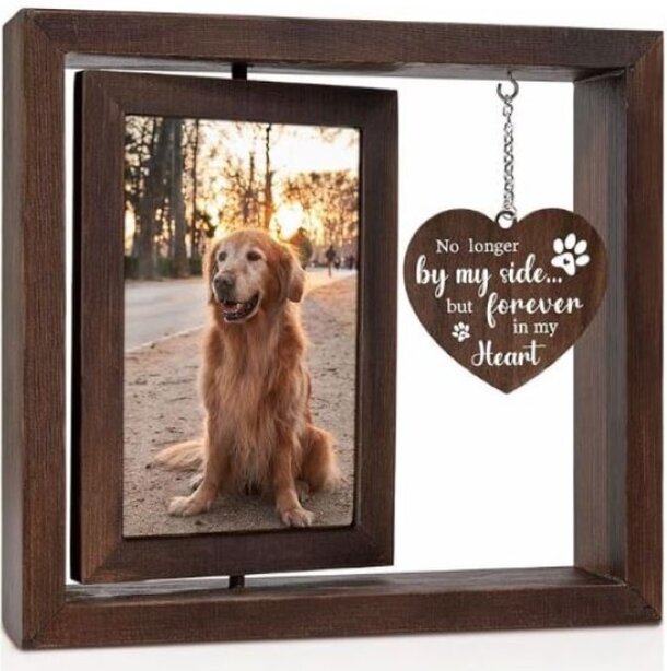 Wooden frame with a photo of a golden retriever sitting at sunset. A heart-shaped plaque reads, "No longer by my side... but forever in my heart."