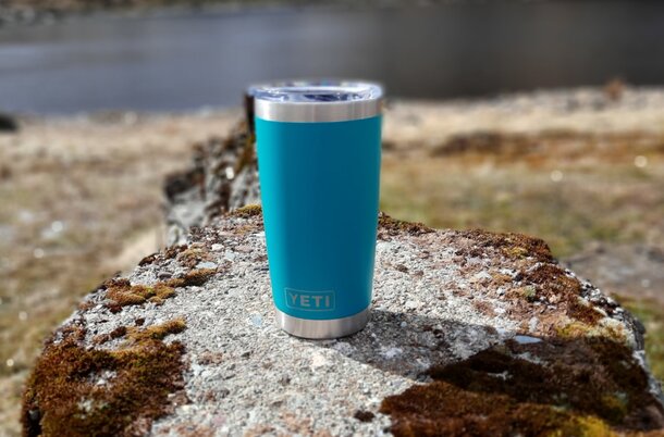 Turquoise Yeti tumbler with a sleek design, ideal for keeping beverages hot or cold.