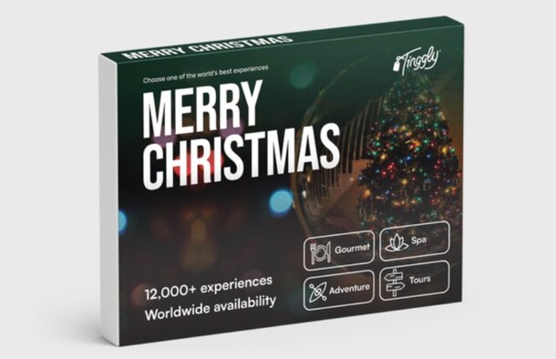 A gift box adorned with the phrase "Merry Christmas" prominently displayed.