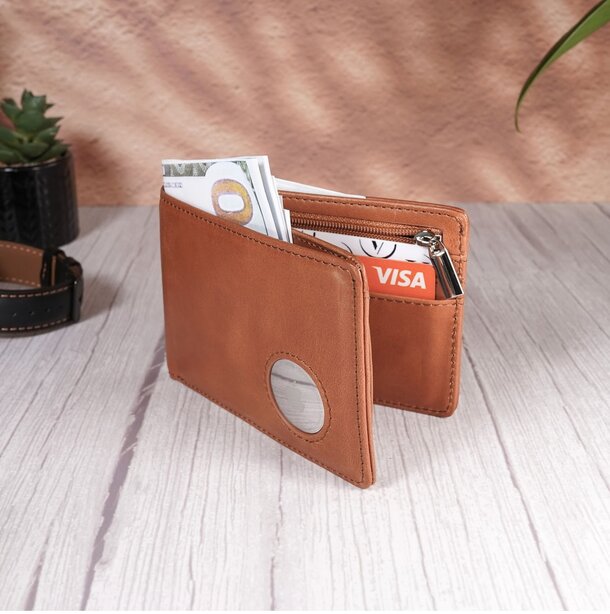 Brown leather wallet with credit cards and cash inside.
