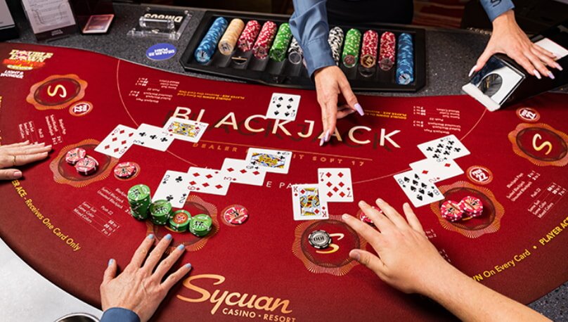 A casino blackjack table with three hands of cards and colorful chips. A dealer points to a card, suggesting a decision moment. The tone is tense yet exciting.