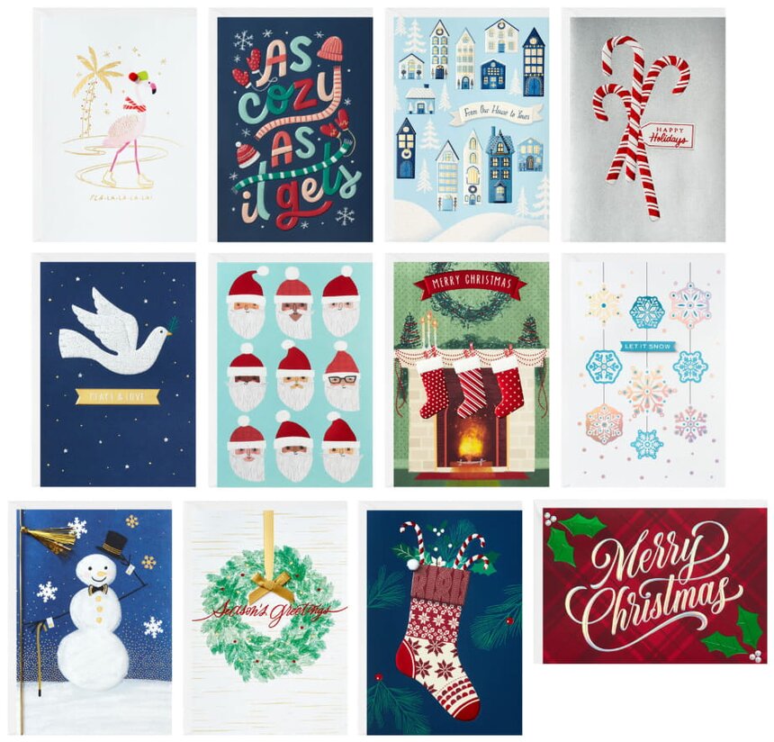 A collection of Christmas cards featuring various festive designs and colors arranged neatly on a table.