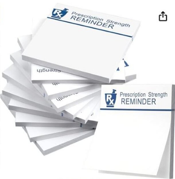 A stack of white sticky notes labeled "Prescription Strength Reminder" for medication adherence.