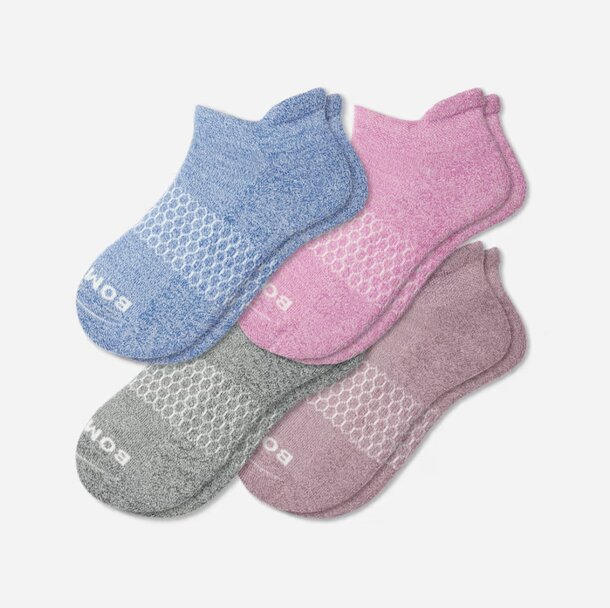 Three pairs of colorful socks displayed together, featuring distinct hues and patterns.