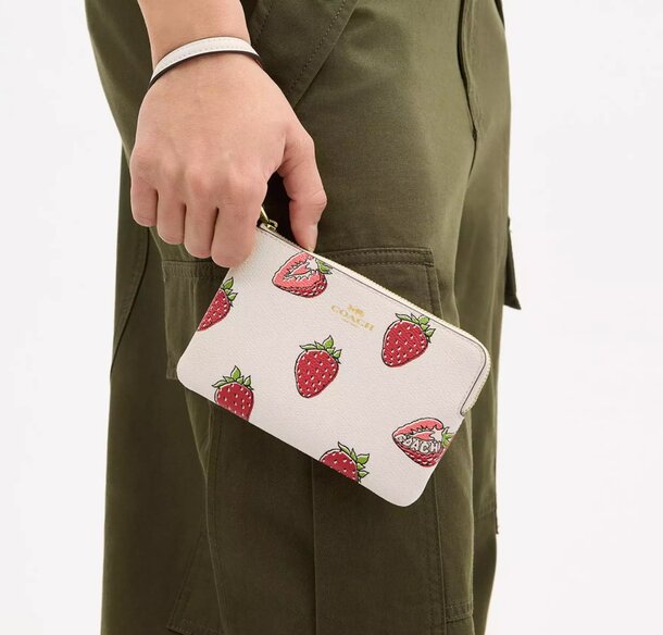 a woman holding her wallet