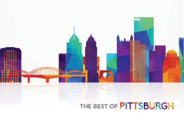 A box of colorful puzzle pieces featuring a detailed city skyline design on the lid.