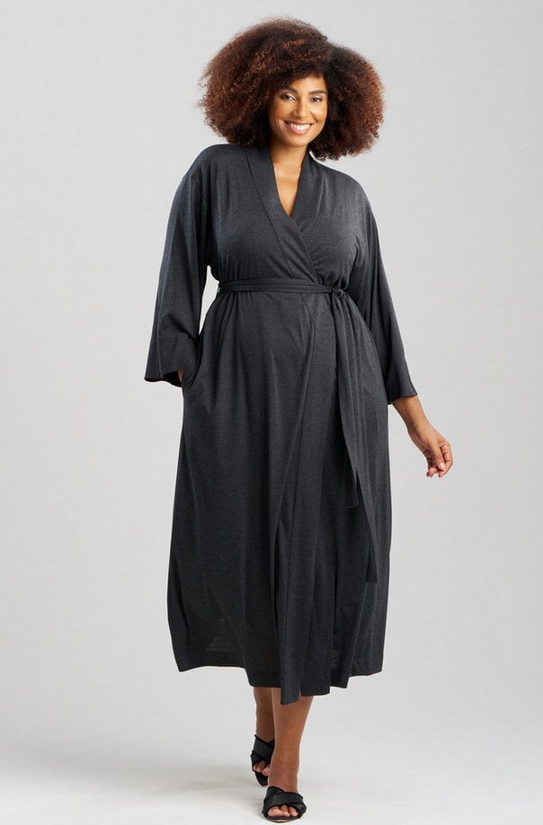 Soft, stretchy fabric defines this plus size wrap dress, offering a flattering fit and elegant look.