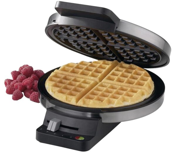 A waffle maker with fresh raspberries displayed on a clean white background.