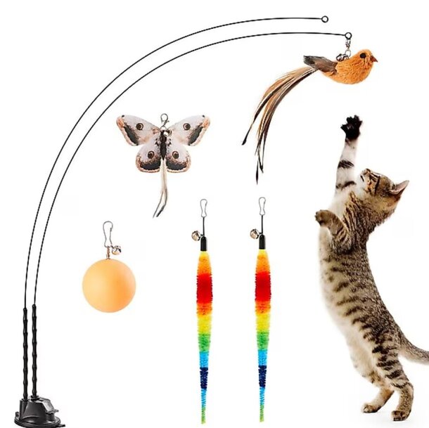 A collection of cat toys featuring a bird, a butterfly, and a colorful cat toy on a soft surface.