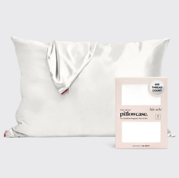Satin pillowcase featuring a white label, showcasing a smooth texture and elegant design.
