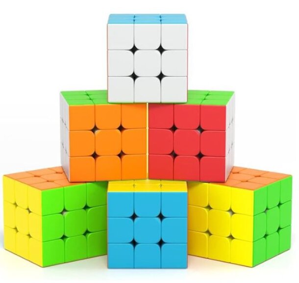 A stack of four vibrant Rubik's cubes, each displaying a different color arrangement, showcasing their playful design.