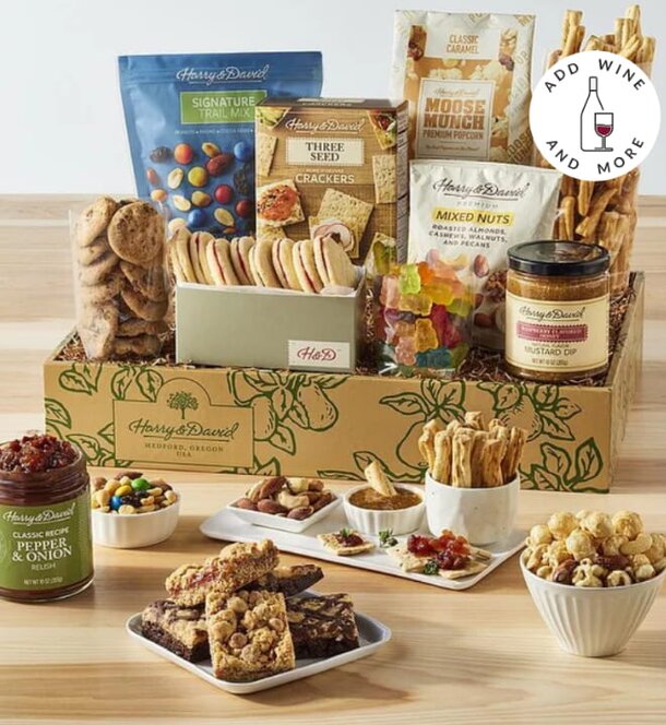 Gourmet gift box featuring an assortment of cookies, crackers, nuts, and various snacks for a delightful treat.