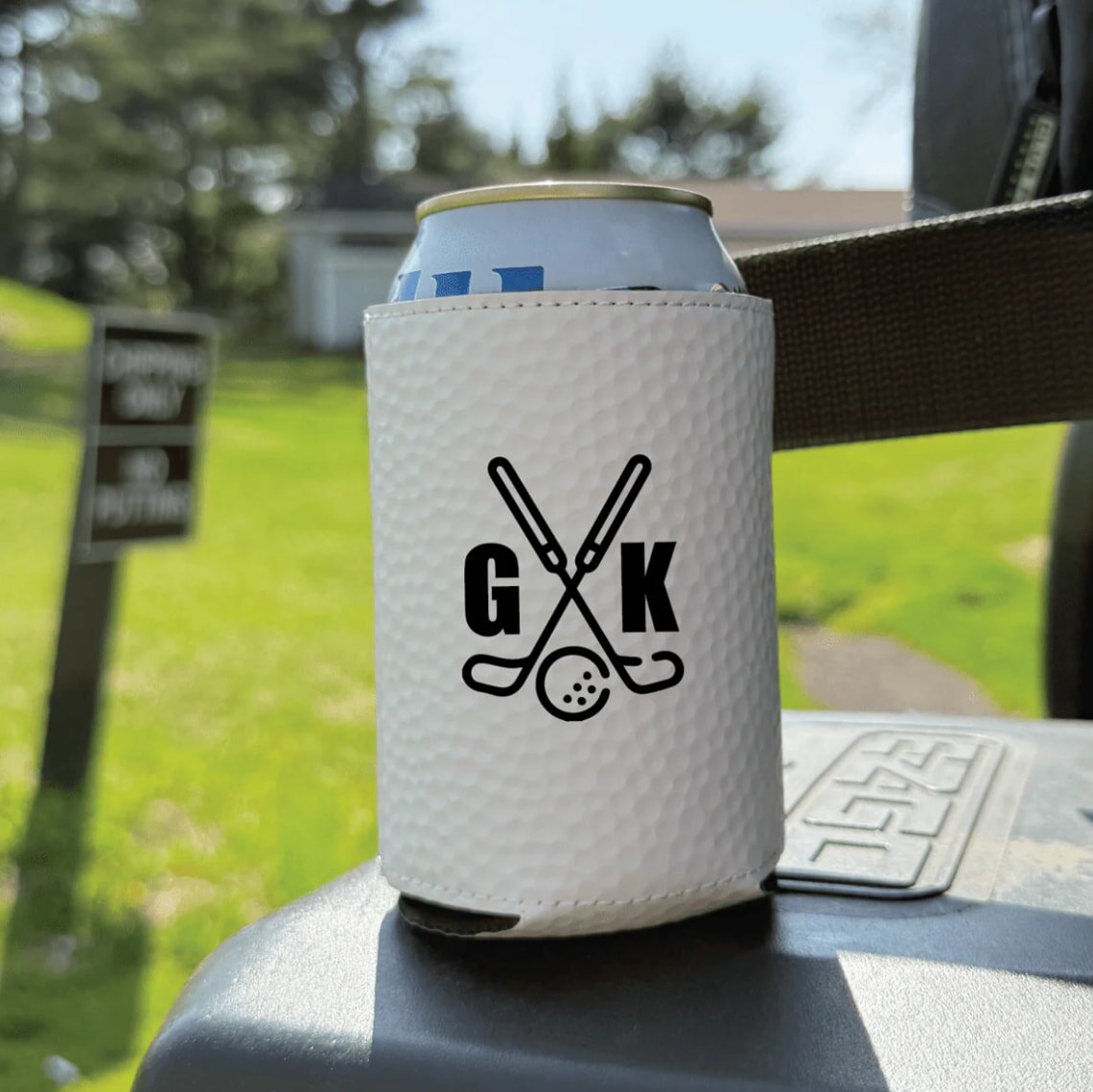 A can cooler featuring a golf club design, perfect for keeping drinks cold on the golf course.