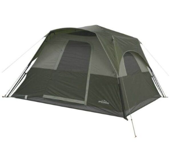 Green and gray Coleman tent set up outdoors, showcasing its spacious design and durable fabric.
