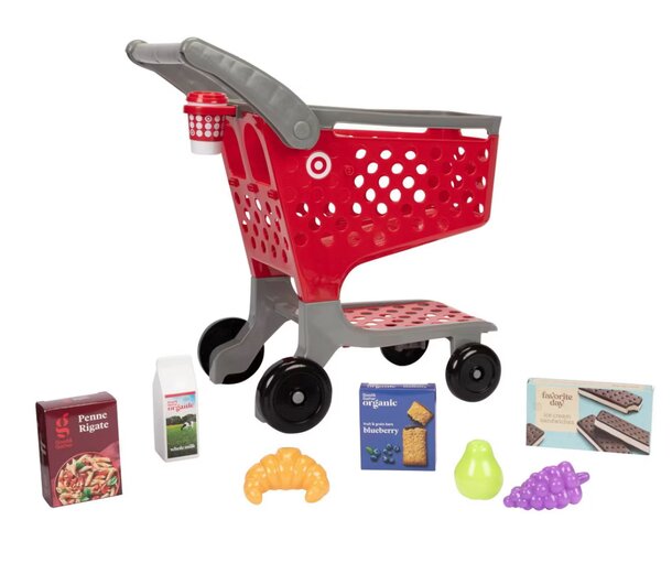 A colorful toy shopping cart filled with various play items, including food, toys, and household goods.