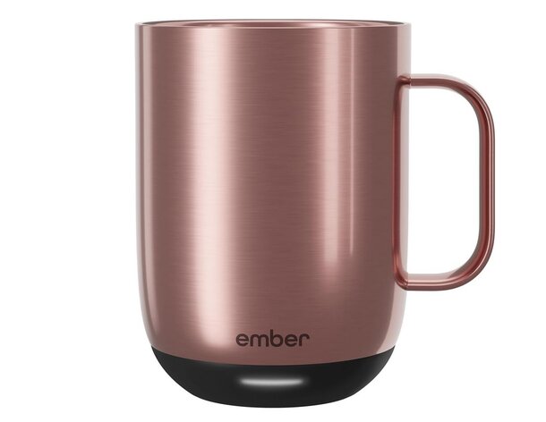 A copper mug featuring a sleek black handle, showcasing a blend of metallic and dark design elements.