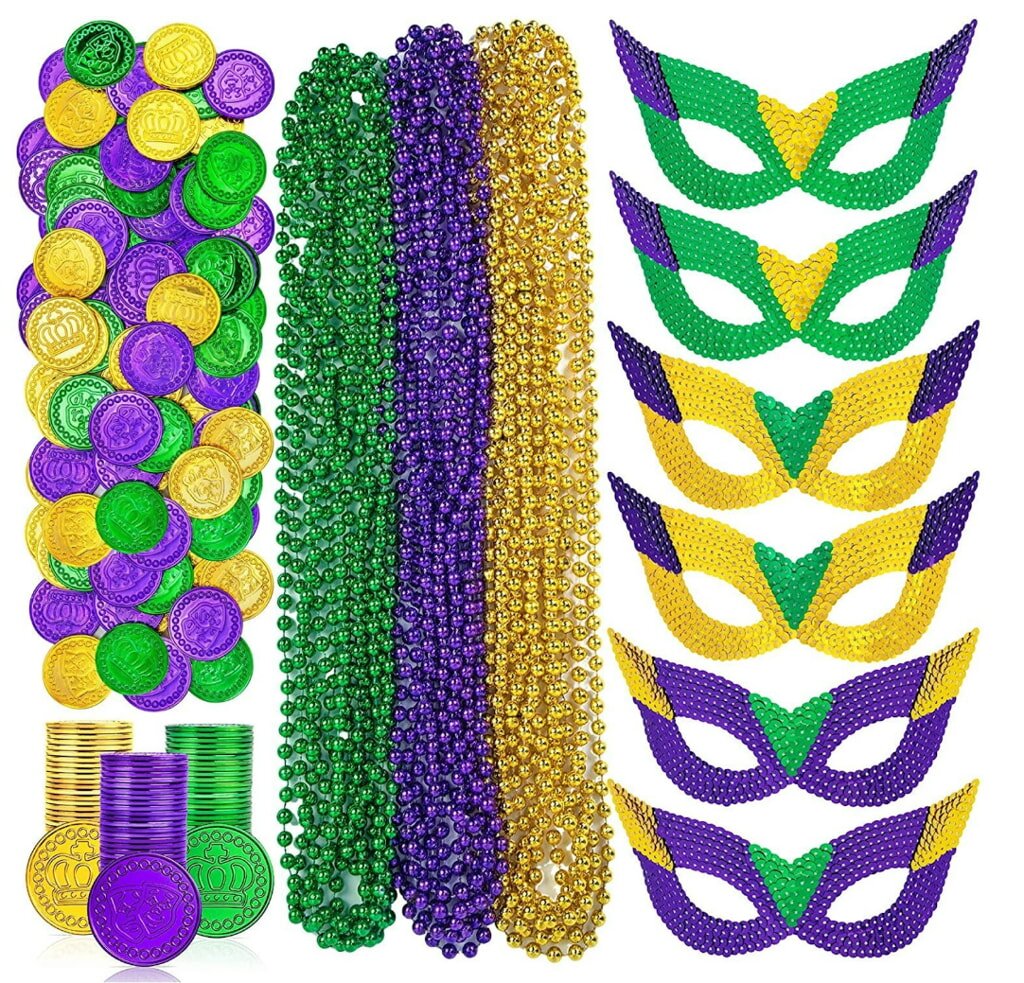 Mardi Gras-themed items: colorful masks in green, purple, and yellow; matching bead necklaces; and coins. Festive, celebratory vibe.
