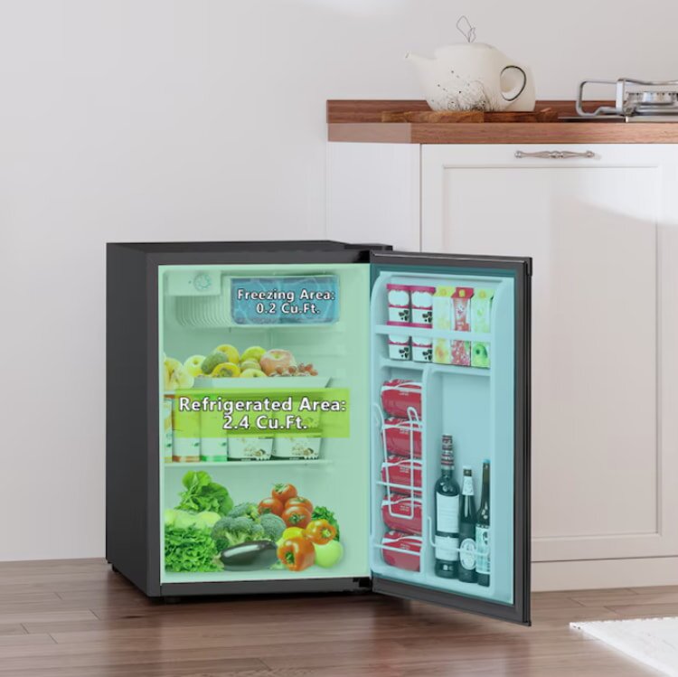 Mini fridge with open door showing interior