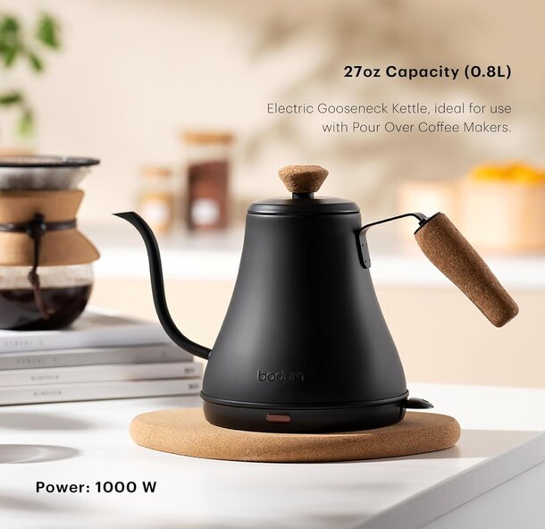 A coffee pot with a kettle resting on it, showcasing a cozy kitchen atmosphere.