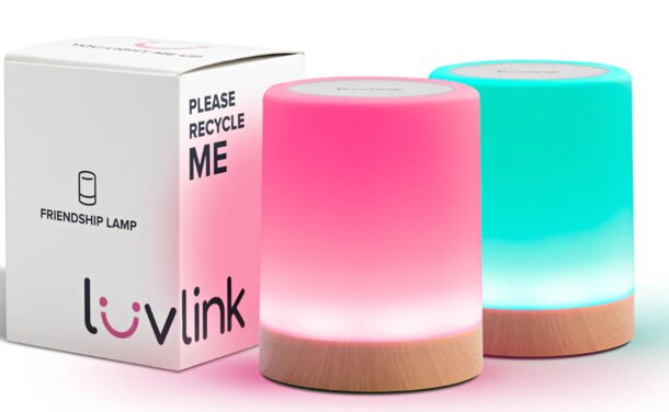 Two vibrant lamps in contrasting colors positioned side by side on a surface.