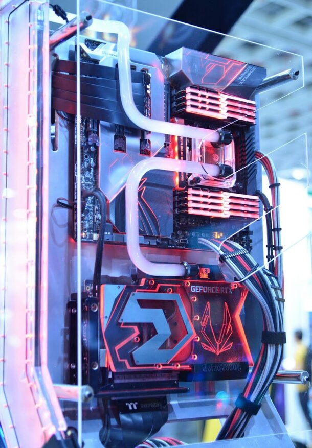 A computer case illuminated with red and blue lights, showcasing a modern and vibrant design.