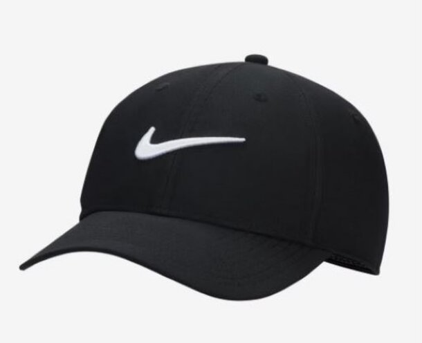 A woman sitting on a bench, wearing headphones, appears to be enjoying music or a podcast in a serene setting.