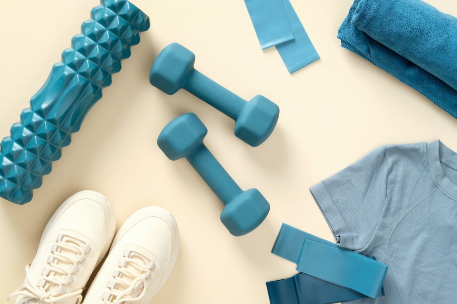 Fitness equipment on beige background