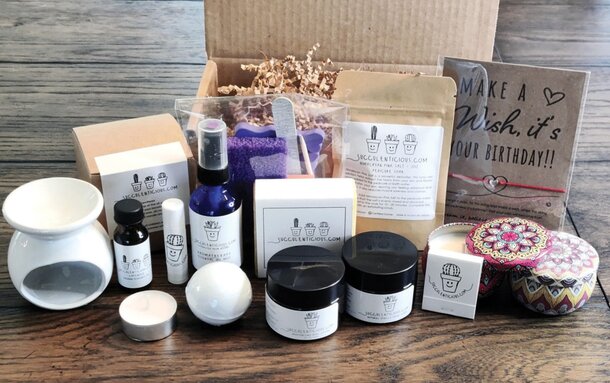 A beauty box filled with an assortment of skincare and makeup products in various sizes and colors.