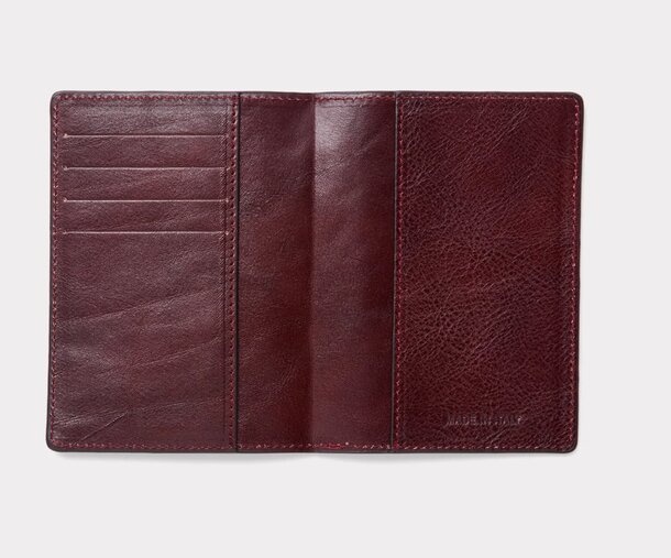 Leather wallet opened to reveal two separate compartments for organization.